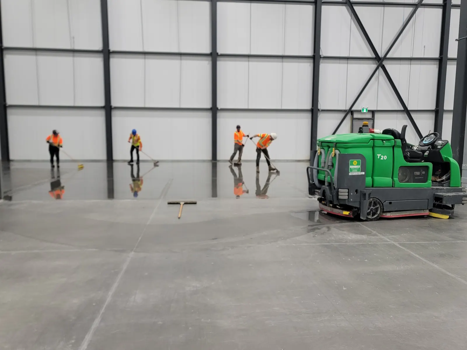 Crew Finishing a New Industrial Floor